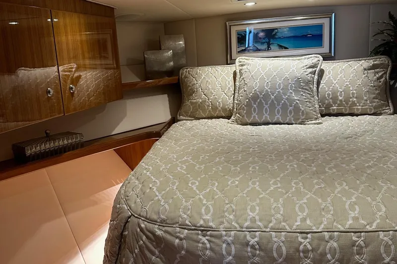 Fluid Power Yacht Photos Pics Luxurious bedroom interior of 2019 Viking 44 Sport Coupe yacht with elegant bedding.