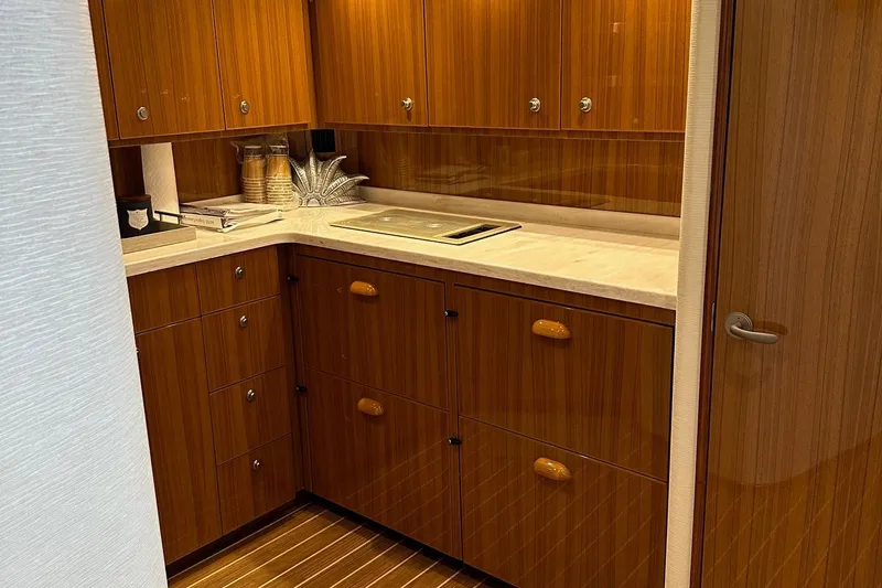 Fluid Power Yacht Photos Pics Luxurious wooden kitchen interior of 2019 Viking 44 Sport Coupe yacht.