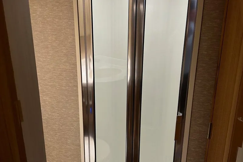 Fluid Power Yacht Photos Pics Shower door inside 2019 Viking 44 Sport Coupe yacht bathroom.