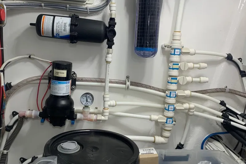 Fluid Power Yacht Photos Pics Engine room of 2019 Viking 44 Sport Coupe with plumbing and filtration system.