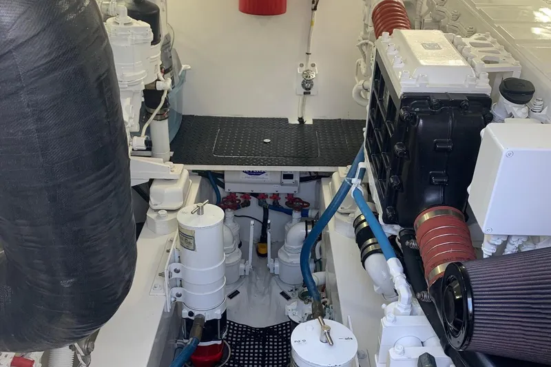 Fluid Power Yacht Photos Pics Engine room of 2019 Viking 44 Sport Coupe with visible components and piping.