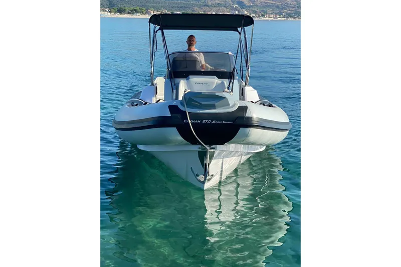  Yacht Photos Pics 2022 Ranieri CAYMAN 27.0 SPORT TOURING boat on clear blue water.