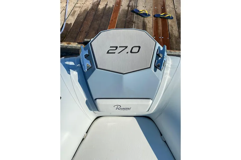  Yacht Photos Pics 2022 Ranieri CAYMAN 27.0 SPORT TOURING boat detail on dock with flip-flops.