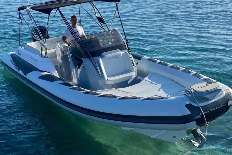  Yacht Photos Pics 2022 Ranieri CAYMAN 27.0 SPORT TOURING boat on clear blue water.