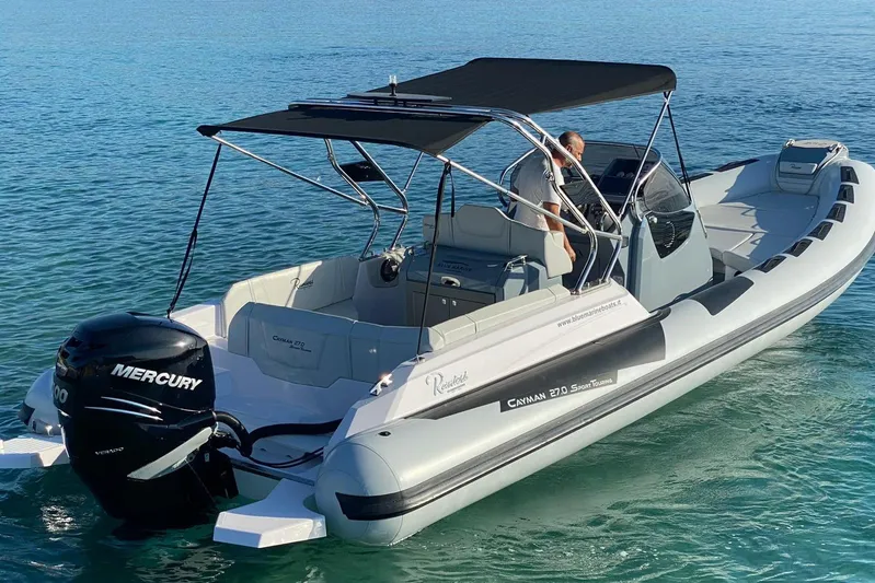  Yacht Photos Pics 2022 Ranieri CAYMAN 27.0 SPORT TOURING boat on clear blue water.