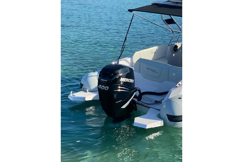  Yacht Photos Pics 2022 Ranieri CAYMAN 27.0 SPORT TOURING with Mercury 400 engine on clear water.