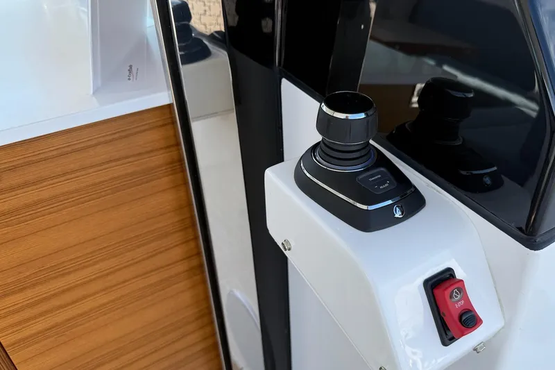  Yacht Photos Pics Control panel of 2026 Delta Powerboats 48 Coupe with joystick and emergency stop button.