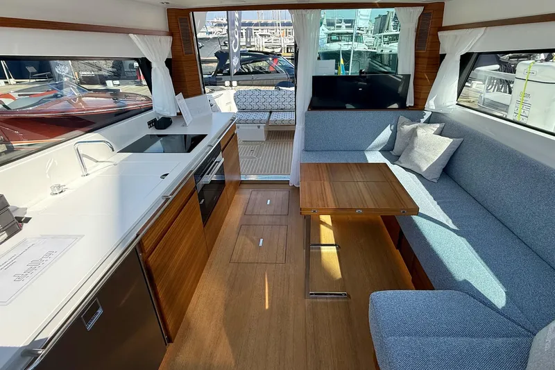  Yacht Photos Pics Interior of 2026 Delta Powerboats 48 Coupe, featuring modern kitchen and seating area.