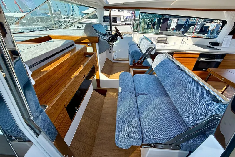  Yacht Photos Pics Interior of 2026 Delta Powerboats 48 Coupe, featuring modern seating and sleek wooden finishes.