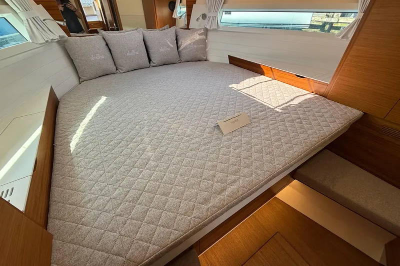  Yacht Photos Pics Luxurious interior of 2026 Delta Powerboats 48 Coupe with spacious bed and elegant design.