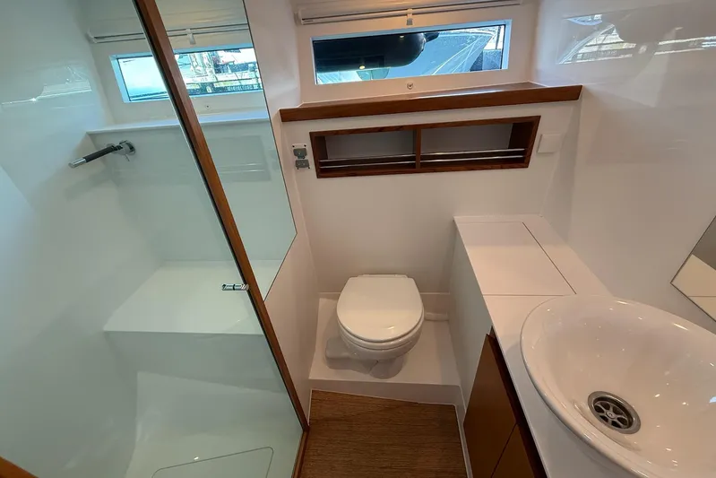  Yacht Photos Pics Modern bathroom in 2026 Delta Powerboats 48 Coupe, featuring sleek design and compact functionality.