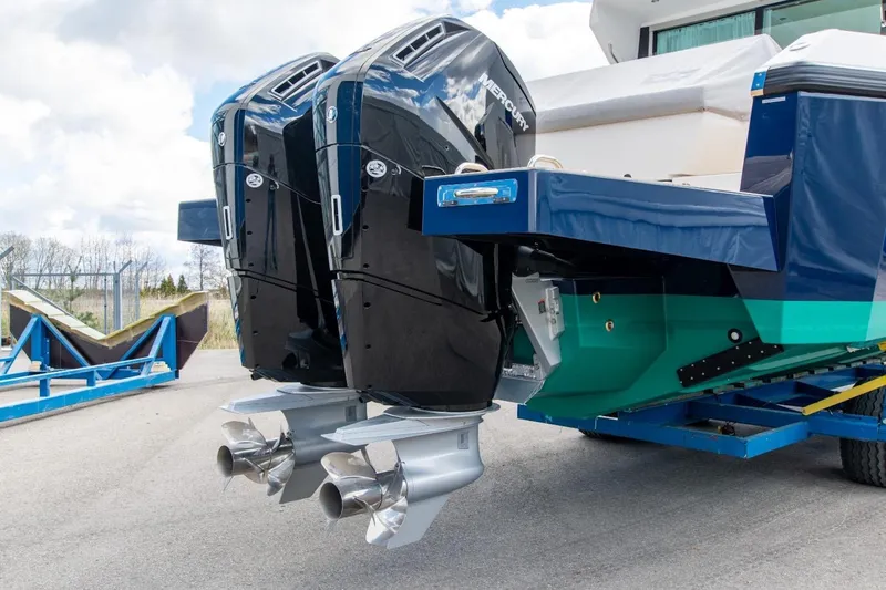  Yacht Photos Pics 2026 Delta Powerboats 48 Coupe with dual Mercury outboard engines on trailer.