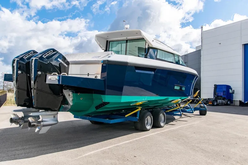 Yacht Photos Pics 2026 Delta Powerboats 48 Coupe on trailer, featuring dual Mercury outboard engines.