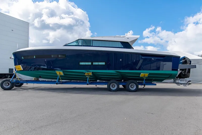  Yacht Photos Pics Delta Powerboats 48 Coupe 2026 model on trailer, sleek design under cloudy sky.