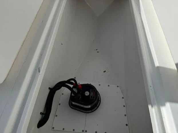 Killin Time II Yacht Photos Pics 2015 Invincible 39 Open Fisherman storage compartment with a black pump.