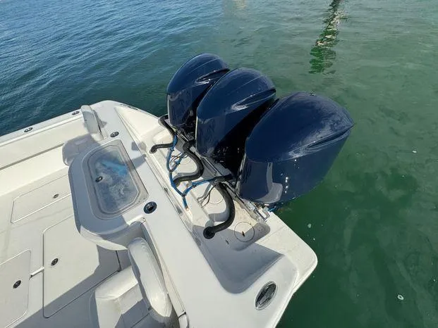 Killin Time II Yacht Photos Pics 2015 Invincible 39 Open Fisherman with triple outboard motors on calm water.