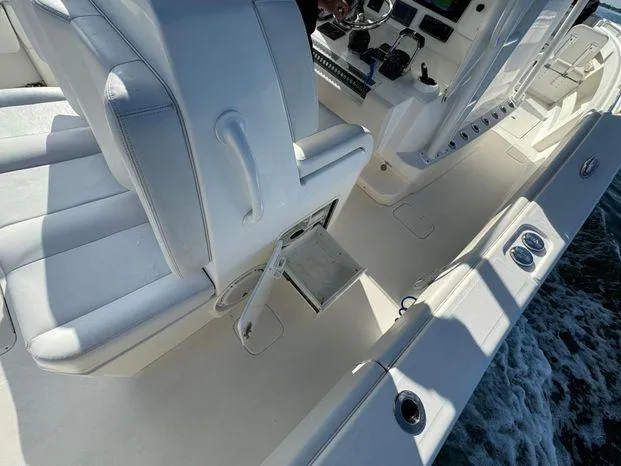 Killin Time II Yacht Photos Pics 2015 Invincible 39 Open Fisherman boat interior with white seating and control panel.