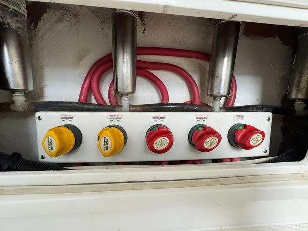 Killin Time II Yacht Photos Pics Control panel with switches and cables on a 2015 Invincible 39 Open Fisherman boat.