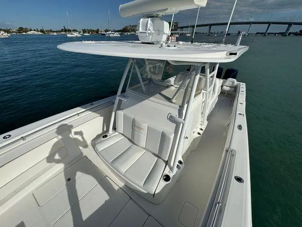 Killin Time II Yacht Photos Pics 2015 Invincible 39 Open Fisherman boat on calm water, featuring spacious deck and seating.