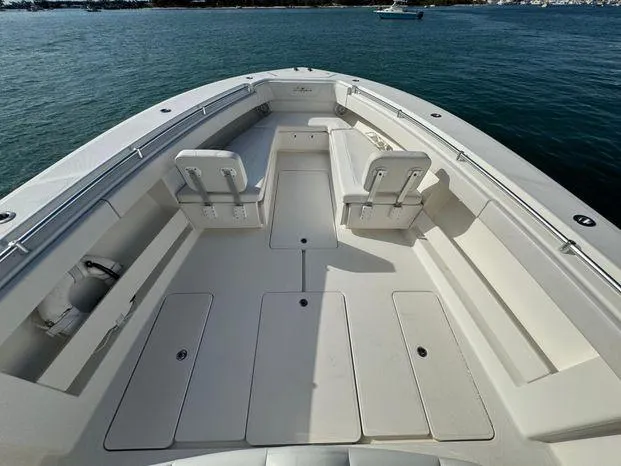 Killin Time II Yacht Photos Pics 2015 Invincible 39 Open Fisherman boat, spacious deck, white seating, calm waters.