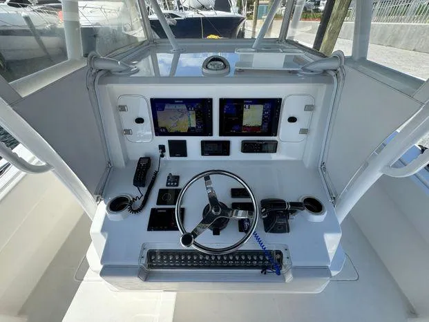 Killin Time II Yacht Photos Pics 2015 Invincible 39 Open Fisherman helm with dual displays and modern controls.