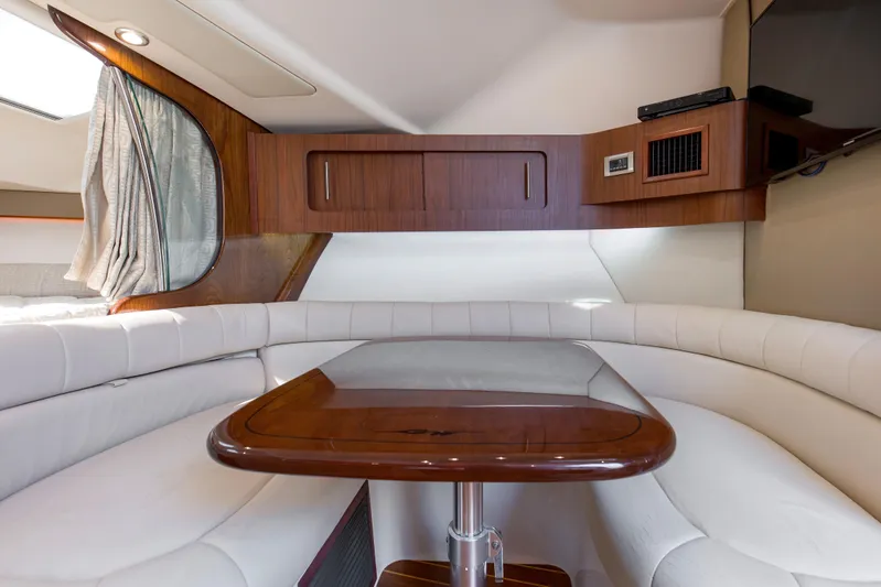 Papa's Dream Yacht Photos Pics 2016 Grady-White Express 370 cabin with elegant wood and white leather seating.