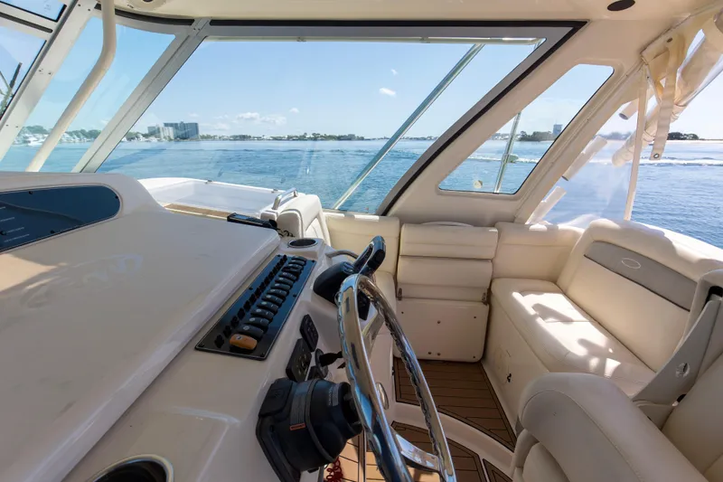 Papa's Dream Yacht Photos Pics Interior view of 2016 Grady-White Express 370 boat, featuring helm and seating area.