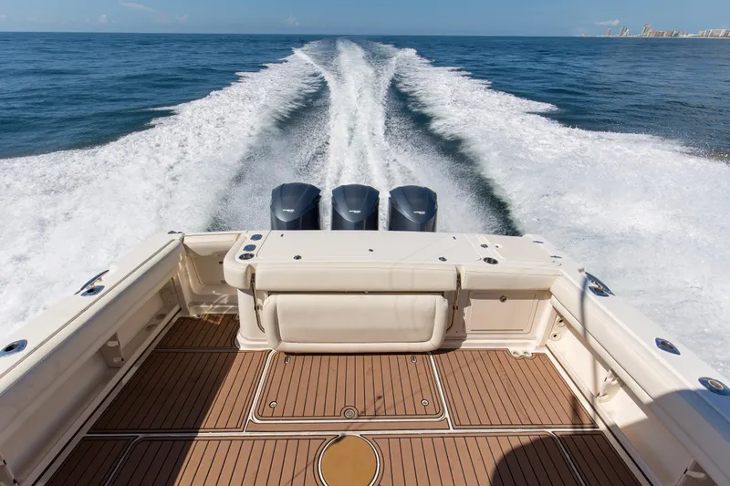 Papa's Dream Yacht Photos Pics 2016 Grady-White Express 370 cruising on open water, showcasing powerful engines and spacious deck.