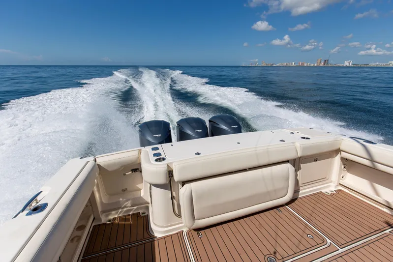 Papa's Dream Yacht Photos Pics 2016 Grady-White Express 370 cruising on open water, leaving a wake behind.