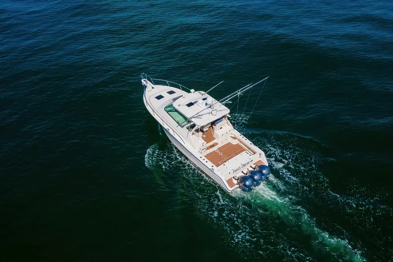 Papa's Dream Yacht Photos Pics 2016 Grady-White Express 370 boat cruising on open water, aerial view.