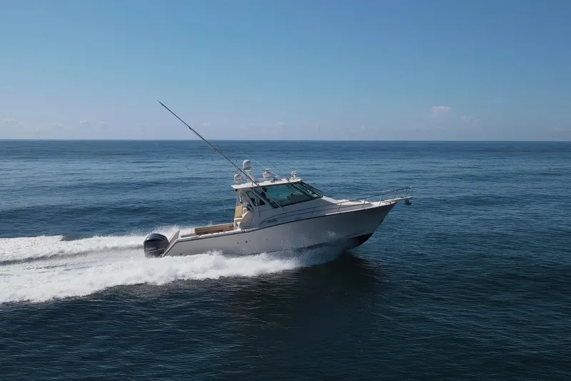 Papa's Dream Yacht Photos Pics 2016 Grady-White Express 370 boat cruising on open ocean waters.