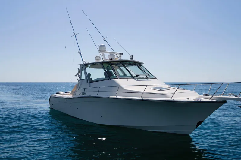 Papa's Dream Yacht Photos Pics 2016 Grady-White Express 370 boat on calm ocean waters under clear sky.