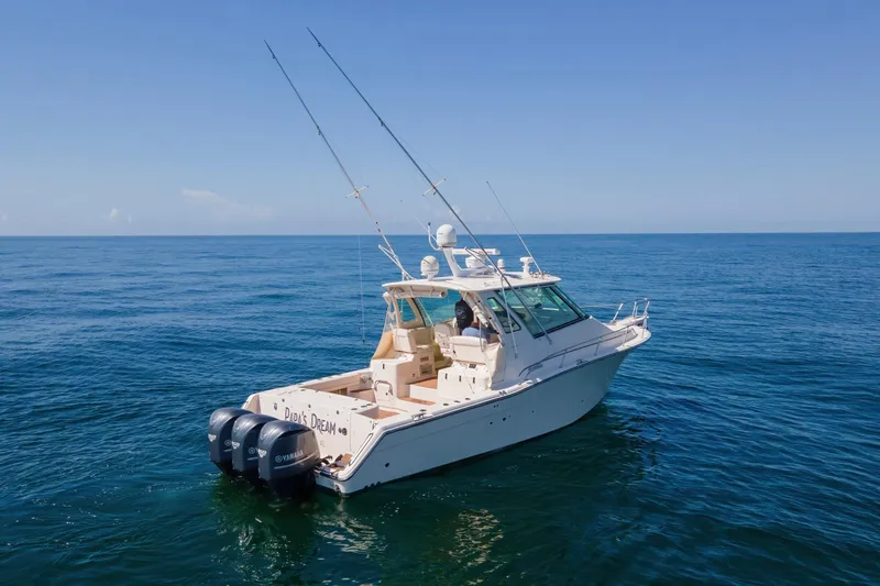 Papa's Dream Yacht Photos Pics 2016 Grady-White Express 370 boat on open sea with clear blue sky.