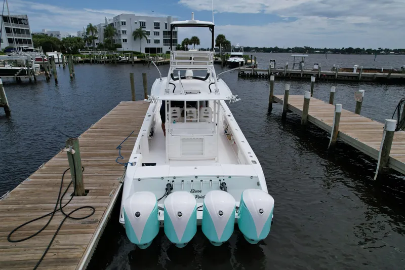 43 Everglades 435 Cc Yacht Photos Pics 2017 Everglades 435 Center Console boat docked at marina with four engines.