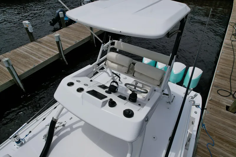 43 Everglades 435 Cc Yacht Photos Pics 2017 Everglades 435 Center Console boat at dock, featuring helm and seating area.