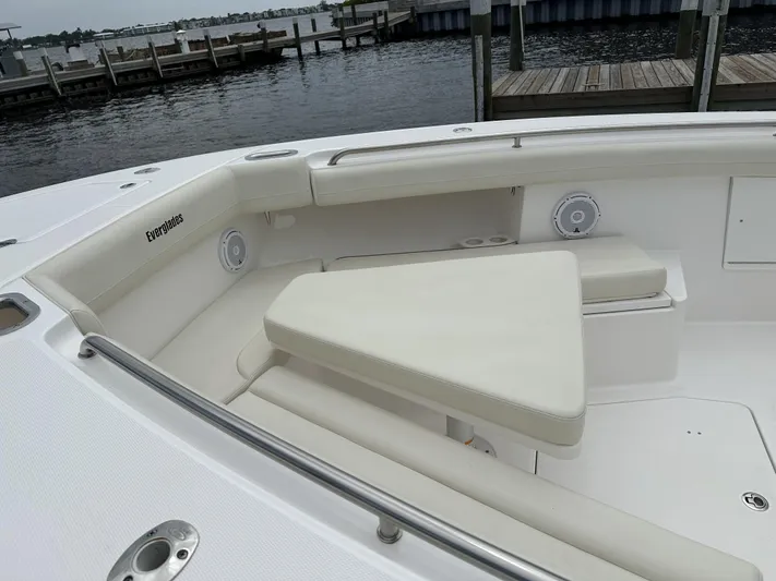 43 Everglades 435 Cc Yacht Photos Pics 2017 Everglades 435 Center Console boat with white seating, docked by the water.