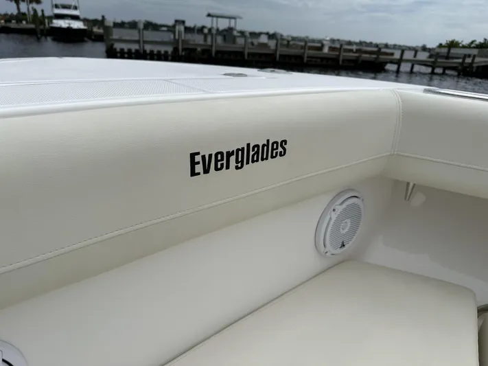 43 Everglades 435 Cc Yacht Photos Pics 2017 Everglades 435 Center Console boat interior with logo and speaker, dockside view.