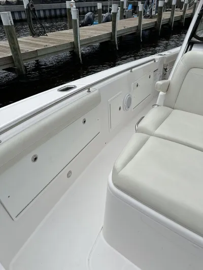 43 Everglades 435 Cc Yacht Photos Pics 2017 Everglades 435 Center Console boat interior with white seating and dockside view.