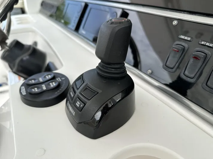 43 Everglades 435 Cc Yacht Photos Pics Control panel of 2017 Everglades 435 Center Console boat with joystick and switches.