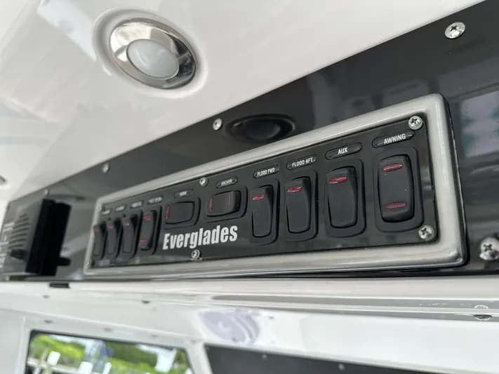 43 Everglades 435 Cc Yacht Photos Pics Control panel of 2017 Everglades 435 Center Console boat with labeled switches.