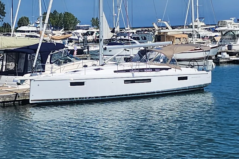 Rondeau Yacht Photos Pics 2020 Jeanneau Sun Odyssey 410 sailboat docked in a marina.