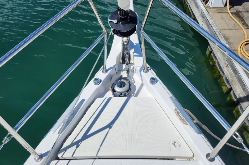 Rondeau Yacht Photos Pics Bow of 2020 Jeanneau Sun Odyssey 410 sailboat with anchor and railing.