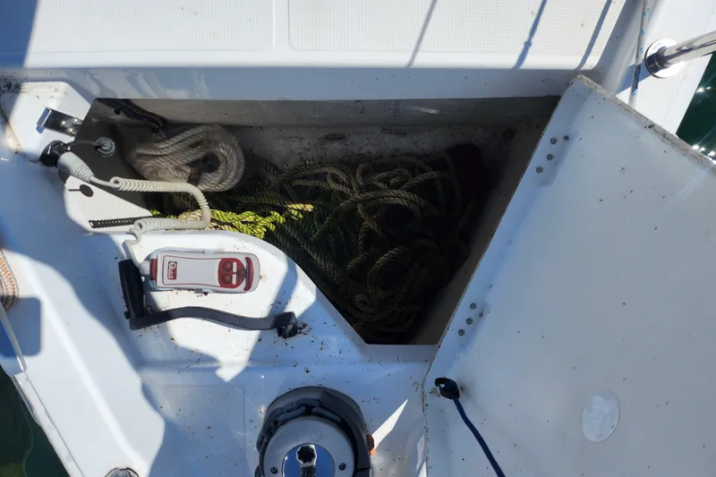Rondeau Yacht Photos Pics Storage compartment on 2020 Jeanneau Sun Odyssey 410 sailboat with ropes and equipment.