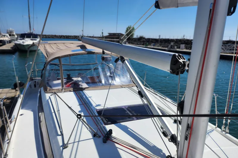 Rondeau Yacht Photos Pics 2020 Jeanneau Sun Odyssey 410 sailboat docked at marina, showcasing deck and rigging.