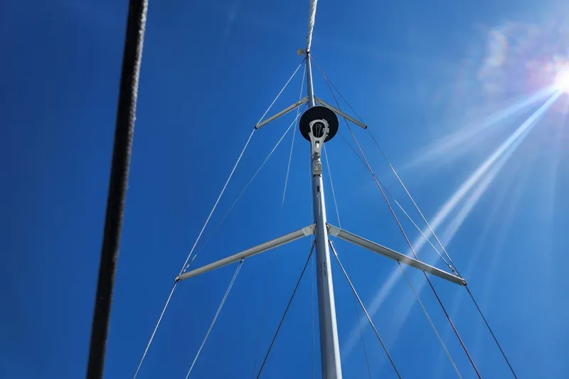 Rondeau Yacht Photos Pics Mast of Jeanneau Sun Odyssey 410 sailboat against clear blue sky, 2020 model.