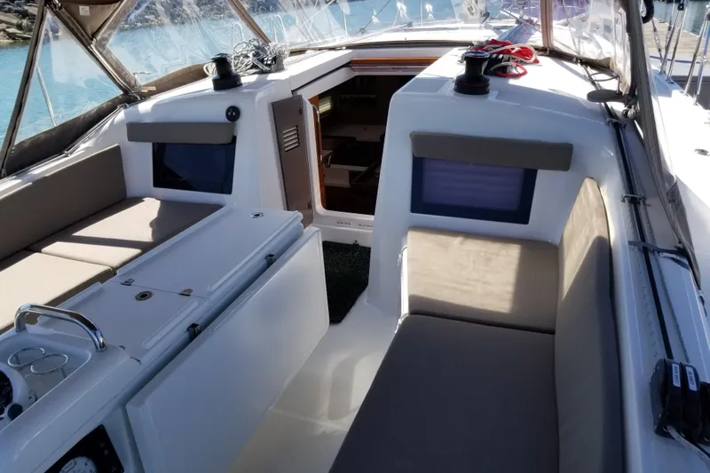 Rondeau Yacht Photos Pics Interior view of 2020 Jeanneau Sun Odyssey 410 sailboat cockpit with seating and controls.