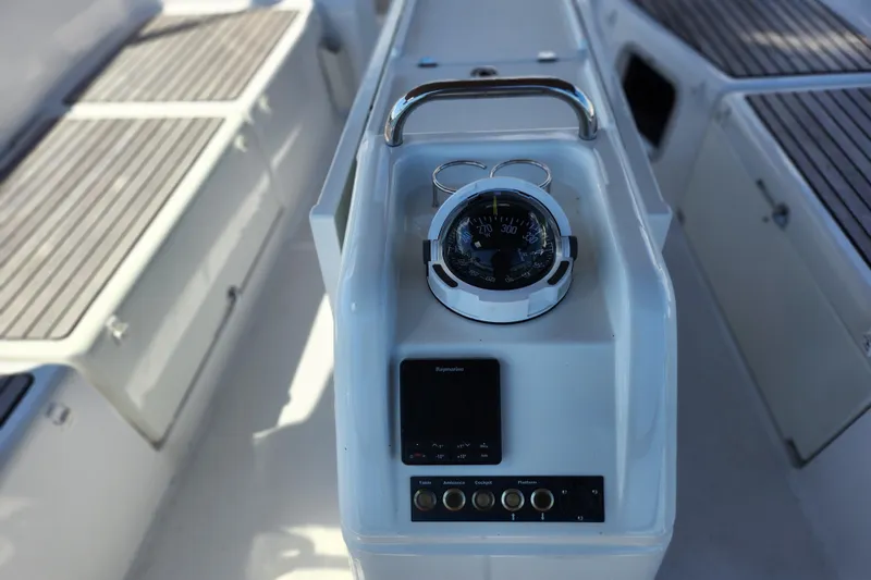Rondeau Yacht Photos Pics Cockpit controls of 2020 Jeanneau Sun Odyssey 410 sailboat, featuring navigation instruments.