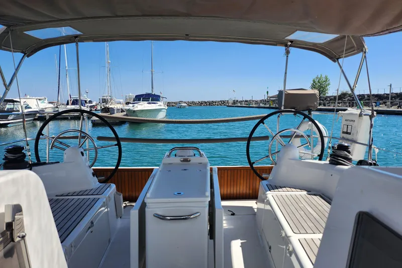 Rondeau Yacht Photos Pics Jeanneau Sun Odyssey 410 sailboat cockpit view in marina, 2020 model.