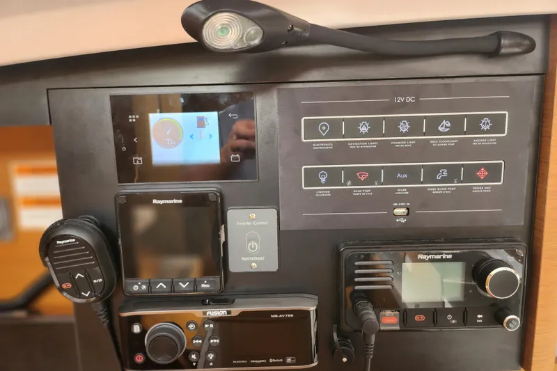 Rondeau Yacht Photos Pics Control panel of a 2020 Jeanneau Sun Odyssey 410 sailboat with navigation and communication equipment.