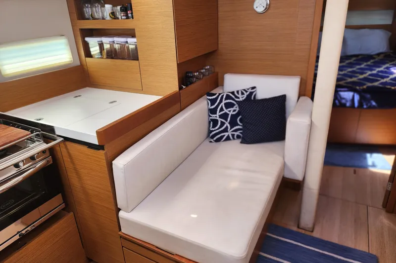 Rondeau Yacht Photos Pics Interior of 2020 Jeanneau Sun Odyssey 410 yacht with cozy seating and modern kitchen.